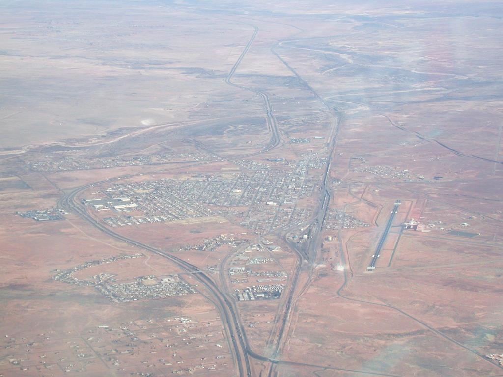 Standing on a corner in Winslow, Arizona (airport to the right)