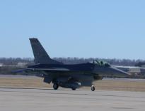 An F-16 taxis by at FSM
